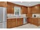 Bright kitchen with lots of wooden cabinets, stainless steel appliances and tile backsplash at 1819 Yorkshire Dr, Woodstock, GA 30189