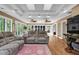 Open concept living room featuring doors to the outside, and neutral decor at 1819 Yorkshire Dr, Woodstock, GA 30189