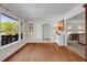 Living room has gleaming hardwood floors and serene views of the backyard at 1819 Yorkshire Dr, Woodstock, GA 30189