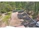 Fenced outdoor riding arena with dirt ground and green trees at 1819 Yorkshire Dr, Woodstock, GA 30189