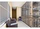 An enclosed balcony overlooking a city view features outdoor seating at 300 Peachtree Ne St # 21H, Atlanta, GA 30308