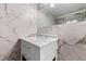 The bathroom features a marble vanity and a well-lit mirror at 300 Peachtree Ne St # 21H, Atlanta, GA 30308