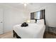 Cozy bedroom with hardwood floors, neutral color palette, and ample natural light at 300 Peachtree Ne St # 21H, Atlanta, GA 30308