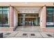 Peachtree Towers features a secure entry with glass doors and prominent signage at 300 Peachtree Ne St # 21H, Atlanta, GA 30308