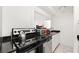 Cozy kitchen featuring modern stainless steel appliances and sleek granite countertops at 300 Peachtree Ne St # 21H, Atlanta, GA 30308