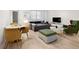 The living room features wood floors, seating, and a dining area at 300 Peachtree Ne St # 21H, Atlanta, GA 30308