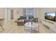 Living room with neutral colors, wood floors, and ample space for relaxation at 300 Peachtree Ne St # 21H, Atlanta, GA 30308