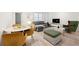 Stylish living room showcasing modern furniture, hardwood floors, and large windows for ample light at 300 Peachtree Ne St # 21H, Atlanta, GA 30308