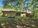 Side view of property highlighting the house and propane tank at 69 N Hearn Rd, Ellenwood, GA 30294