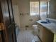 Bathroom featuring a sink, toilet and tub at 69 N Hearn Rd, Ellenwood, GA 30294