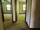 Hallway with a view into two bedrooms at 69 N Hearn Rd, Ellenwood, GA 30294