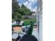 Backyard patio with outdoor seating, a grill, and a view of the wooded surroundings at 7881 Chadwick Ln, Riverdale, GA 30274