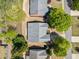 An aerial view showing the layout of the house, its roof, and the surrounding landscape and neighborhood at 1330 Badingham Dr, Cumming, GA 30041