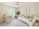 Cozy bedroom featuring neutral tones, soft lighting, and comfortable seating at 1330 Badingham Dr, Cumming, GA 30041