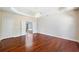 A light-filled room showcases hardwood flooring, large doorways, and neutral paint colors at 1330 Badingham Dr, Cumming, GA 30041