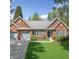 Charming brick home with a well-manicured lawn, blue shutters, and a two-car garage at 1330 Badingham Dr, Cumming, GA 30041