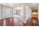 Bright, open room with hardwood flooring, large windows, and classic trim at 1330 Badingham Dr, Cumming, GA 30041