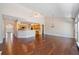 Open-concept layout with hardwood flooring, bright windows and kitchen in background at 1330 Badingham Dr, Cumming, GA 30041