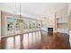Spacious living area with fireplace, large windows, and access to the backyard at 1330 Badingham Dr, Cumming, GA 30041