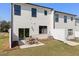 Exterior view of home with backyard patio at 1028 Sutherland Lane (Lot 45), Lawrenceville, GA 30043