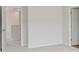 Light and airy bedroom featuring carpeted floors and clean white walls at 1028 Sutherland Lane (Lot 45), Lawrenceville, GA 30043