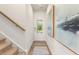 Bright hallway with stairs, wood floors, and decorative artwork at 1028 Sutherland Lane (Lot 45), Lawrenceville, GA 30043