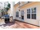 Outdoor back deck space with a gas grill, sunny exposure, and a backyard view at 4557 Waldens Farm Ct, Powder Springs, GA 30127