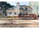 Two-story home featuring a large wooden deck perfect for outdoor entertaining in a private backyard at 4557 Waldens Farm Ct, Powder Springs, GA 30127