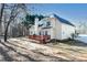 Charming two-story home featuring a large wooden deck perfect for outdoor entertaining in a private backyard at 4557 Waldens Farm Ct, Powder Springs, GA 30127