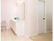 Bathroom featuring a vanity with ample storage and a decorative vanity chair at 4557 Waldens Farm Ct, Powder Springs, GA 30127