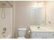 Bathroom featuring a neutral vanity and a shower-tub combo at 4557 Waldens Farm Ct, Powder Springs, GA 30127