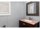 Bathroom vanity featuring a dark wood cabinet and marble countertop at 4557 Waldens Farm Ct, Powder Springs, GA 30127