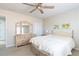 Comfortable bedroom with natural light, a ceiling fan, and a coordinated furniture set at 4557 Waldens Farm Ct, Powder Springs, GA 30127