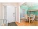 Bright dining area with hardwood floors, a chandelier, and a unique aquarium adding charm to the space at 4557 Waldens Farm Ct, Powder Springs, GA 30127