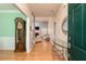 Inviting entryway with hardwood floors, a grandfather clock, and a clear view into the spacious living room at 4557 Waldens Farm Ct, Powder Springs, GA 30127
