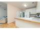 Kitchen featuring a breakfast bar that leads to a living area at 4557 Waldens Farm Ct, Powder Springs, GA 30127