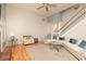 Bright living room boasts hardwood floors, high ceilings, and a cozy fireplace for comfortable living at 4557 Waldens Farm Ct, Powder Springs, GA 30127