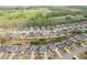 Residential neighborhood with lush green trees, showcasing a desirable location near green fields at 6060 Country Lake Rd, Cumming, GA 30041