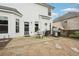 Backyard patio with outdoor dining set, grill, and lush landscaping at 6060 Country Lake Rd, Cumming, GA 30041