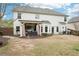 Exterior of home, back view with covered patio, grill, and fenced yard at 6060 Country Lake Rd, Cumming, GA 30041