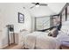 A teenager's bedroom featuring a basketball hoop, a football, and a ceiling fan at 6060 Country Lake Rd, Cumming, GA 30041