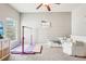 Well-lit bonus room featuring a shiplap wall, gymnastics bar and plush carpet at 6060 Country Lake Rd, Cumming, GA 30041
