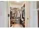 Walk-in closet with built in storage for shoes and clothes at 6060 Country Lake Rd, Cumming, GA 30041