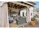 Charming covered patio with comfortable seating, string lights, and outdoor decor at 6060 Country Lake Rd, Cumming, GA 30041