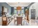 Well-appointed dining room with modern decor, natural light, and views of the front yard at 6060 Country Lake Rd, Cumming, GA 30041