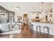 Open floor plan showing kitchen and living area with hardwood floors and modern finishes at 6060 Country Lake Rd, Cumming, GA 30041