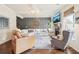 Bright living room with fireplace, hardwood flooring, and a comfortable seating arrangement at 6060 Country Lake Rd, Cumming, GA 30041