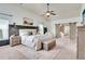 Spacious main bedroom with vaulted ceiling, neutral color palette, sitting area, and barn doors at 6060 Country Lake Rd, Cumming, GA 30041