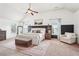 Spacious main bedroom with vaulted ceiling, neutral color palette, sitting area and lots of natural light at 6060 Country Lake Rd, Cumming, GA 30041