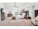 Spacious main bedroom with vaulted ceiling, neutral color palette, sitting area and lots of natural light at 6060 Country Lake Rd, Cumming, GA 30041